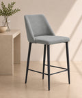 Sgabello moderno grigio con seduta imbottita e gambe in metallo