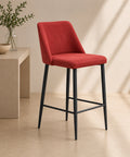 Sgabello moderno rosso con seduta imbottita e gambe in metallo