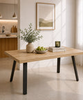 Tavolo allungabile Mirò con piano finitura Quercia e gambe in metallo antracite, design moderno per cucina e sala da pranzo.